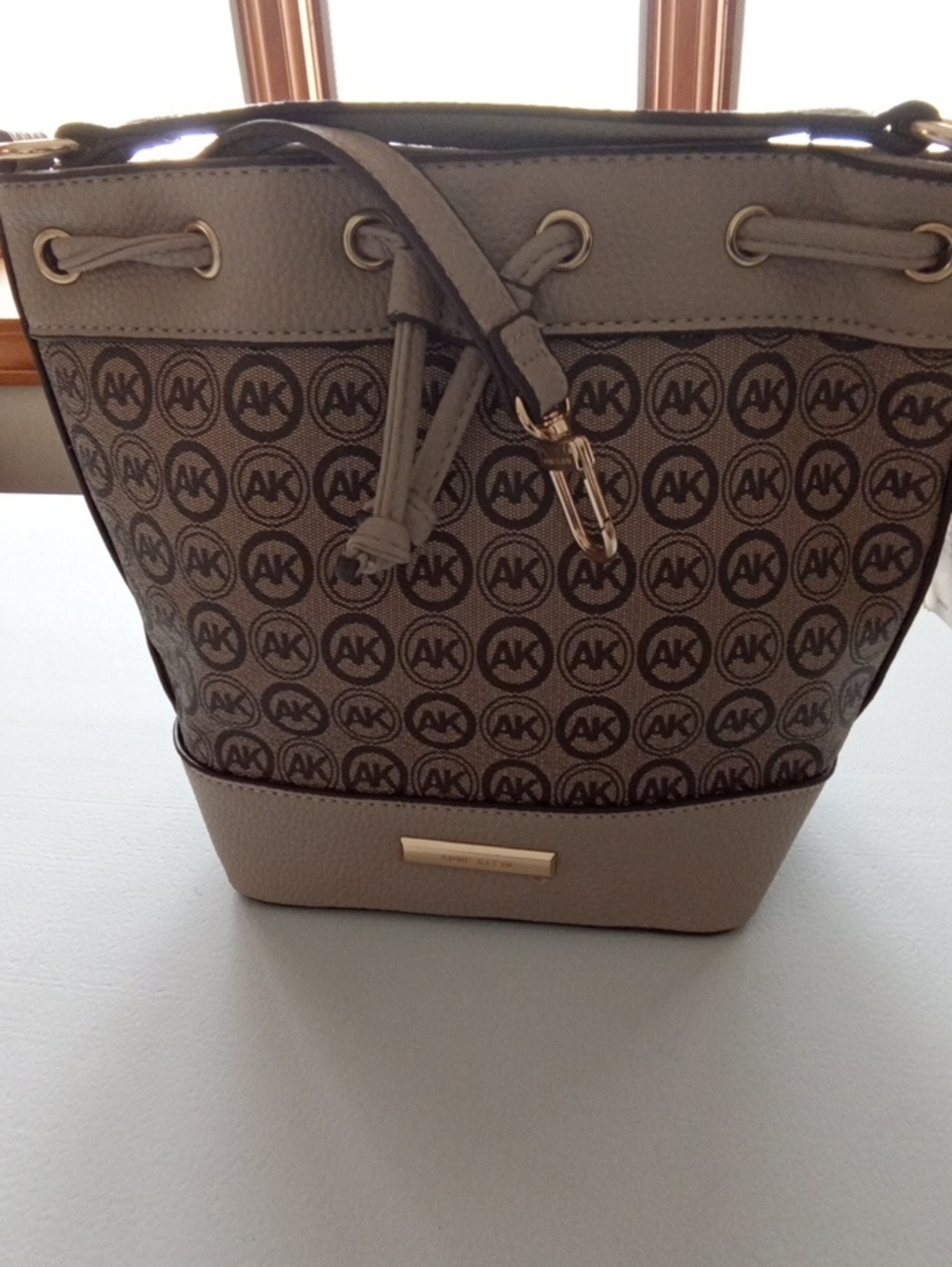 Anne Klein Taupe AK Monogram Drawstring Shoulder Bag